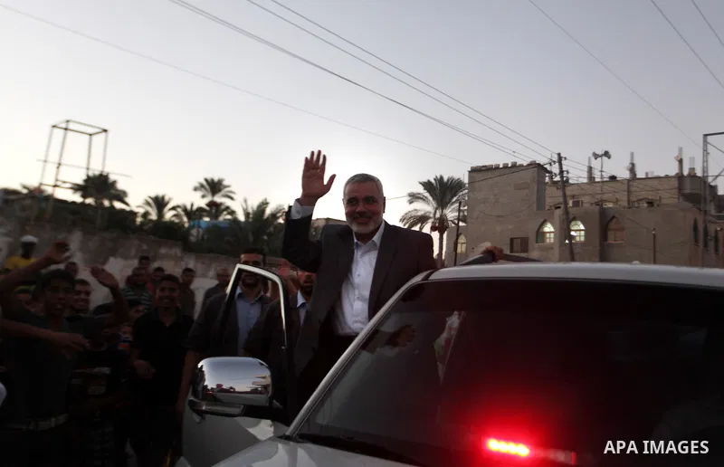 Senior leader of Hamas Ismail Haniyeh gets welcome during his inspection visit to the Deir al-Balah in the central Gaza Strip, on September 10, 2014. Hamas's exiled deputy leader said Wednesday that indirect talks with I...