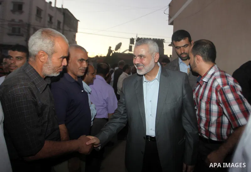 Senior leader of Hamas Ismail Haniyeh gets welcome during his inspection visit to the Deir al-Balah in the central Gaza Strip, on September 10, 2014. Hamas's exiled deputy leader said Wednesday that indirect talks with I...
