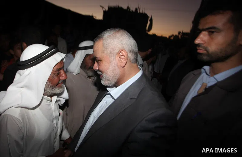 Senior leader of Hamas Ismail Haniyeh gets welcome during his inspection visit to the Deir al-Balah in the central Gaza Strip, on September 10, 2014. Hamas's exiled deputy leader said Wednesday that indirect talks with I...