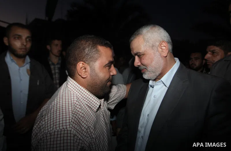 Senior leader of Hamas Ismail Haniyeh gets welcome during his inspection visit to the Deir al-Balah in the central Gaza Strip, on September 10, 2014. Hamas's exiled deputy leader said Wednesday that indirect talks with I...