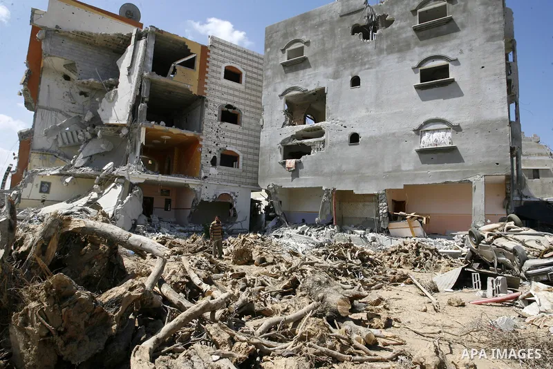 Palestinians search in the rubble of a destroyed house in Khan Yunis in the southern Gaza Strip on September 11, 2014. Israel's deputy foreign minister,Tzahi Hanegbi , warned that Hamas was likely to resume "violence" if...
