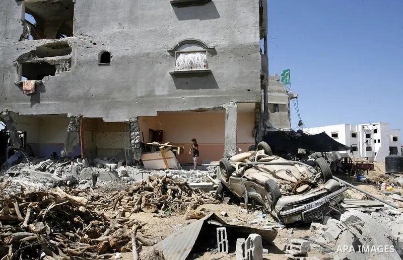 Palestinians search in the rubble of a destroyed house in Khan Yunis in the southern Gaza Strip on September 11, 2014. Israel's deputy foreign minister,Tzahi Hanegbi , warned that Hamas was likely to resume "violence" if...