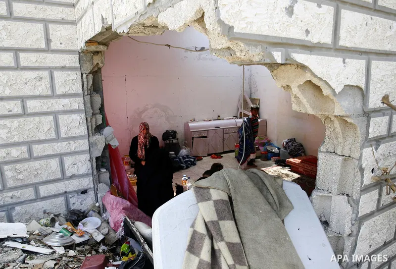 Palestinians search in their destroyed house in Khan Yunis in the southern Gaza Strip on September 11, 2014. Israel's deputy foreign minister,Tzahi Hanegbi , warned that Hamas was likely to resume "violence" if it feels...