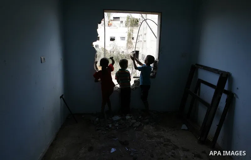 Palestinian children play in a destroyed house in Khan Yunis in the southern Gaza Strip on September 11, 2014. Israel's deputy foreign minister,Tzahi Hanegbi , warned that Hamas was likely to resume "violence" if it feel...