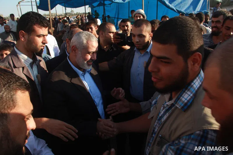 Senior leader of Hamas Ismail Haniyeh gets welcome during his inspection visit to Rafah in the southern Gaza Strip, on September 12, 2014. Hamas's exiled deputy leader said Wednesday that indirect talks with Israel to co...