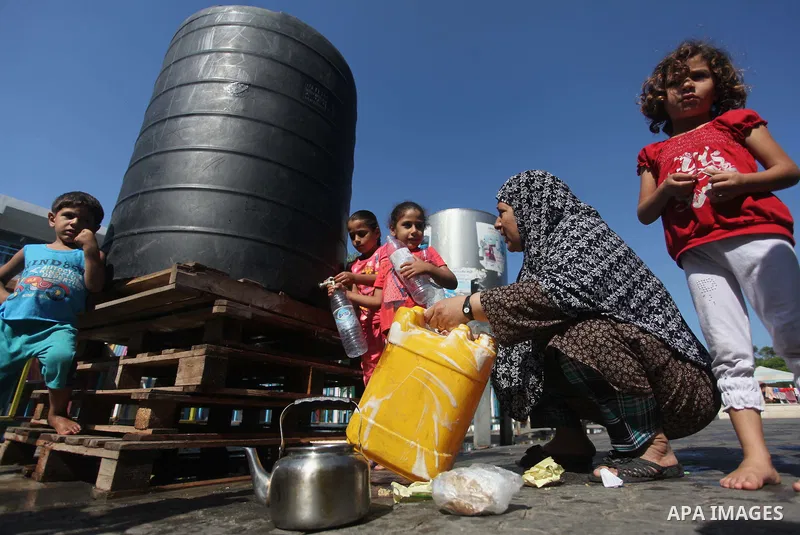 Displaced Palestinians shelter at a United Nations-run school, in Gaza city, on Sept. 13, 2014. Some 34 school buildings in Gaza are damaged beyond repair and 31 more are still being used as shelters, while Gaza prepare...