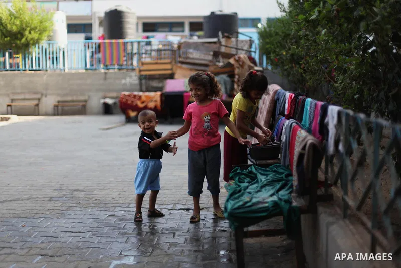 Displaced Palestinians shelter at a United Nations-run school, in Gaza city, on Sept. 13, 2014. Some 34 school buildings in Gaza are damaged beyond repair and 31 more are still being used as shelters, while Gaza prepare...