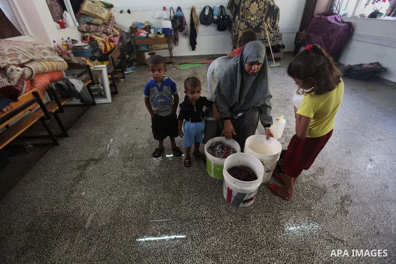 Displaced Palestinians shelter at a United Nations-run school, in Gaza city, on Sept. 13, 2014. Some 34 school buildings in Gaza are damaged beyond repair and 31 more are still being used as shelters, while Gaza prepare...