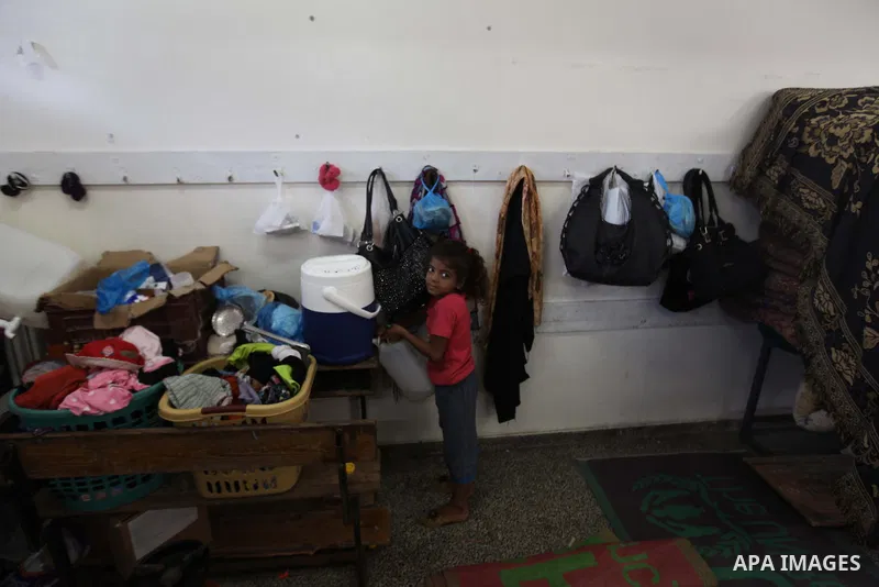 Displaced Palestinians shelter at a United Nations-run school, in Gaza city, on Sept. 13, 2014. Some 34 school buildings in Gaza are damaged beyond repair and 31 more are still being used as shelters, while Gaza prepare...