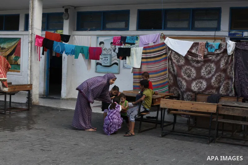 Displaced Palestinians shelter at a United Nations-run school, in Gaza city, on Sept. 13, 2014. Some 34 school buildings in Gaza are damaged beyond repair and 31 more are still being used as shelters, while Gaza prepare...