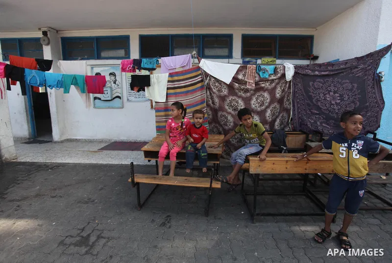 Displaced Palestinians shelter at a United Nations-run school, in Gaza city, on Sept. 13, 2014. Some 34 school buildings in Gaza are damaged beyond repair and 31 more are still being used as shelters, while Gaza prepare...