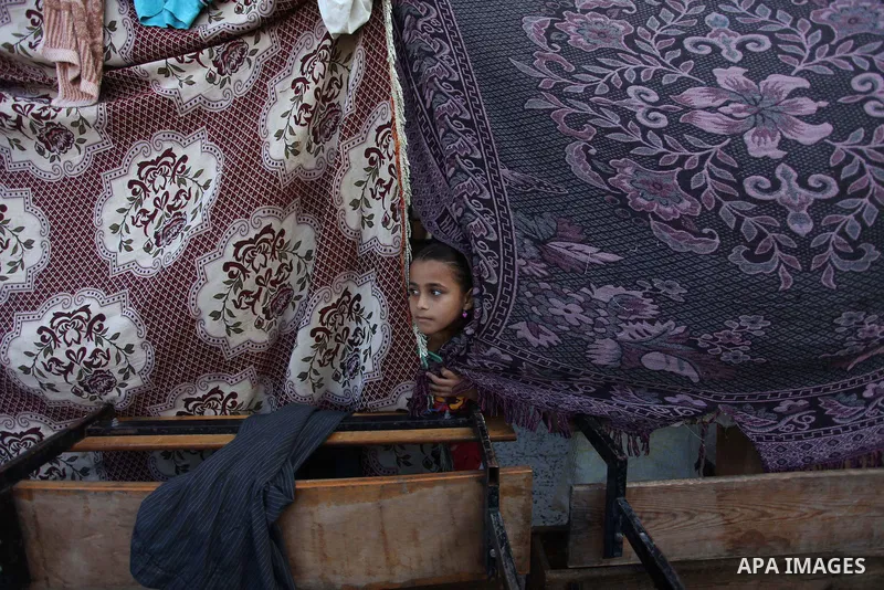 Displaced Palestinians shelter at a United Nations-run school, in Gaza city, on Sept. 13, 2014. Some 34 school buildings in Gaza are damaged beyond repair and 31 more are still being used as shelters, while Gaza prepare...