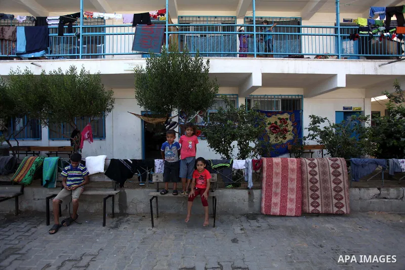 Displaced Palestinians shelter at a United Nations-run school, in Gaza city, on Sept. 13, 2014. Some 34 school buildings in Gaza are damaged beyond repair and 31 more are still being used as shelters, while Gaza prepare...