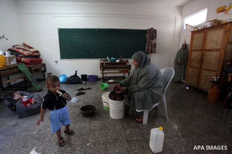 Displaced Palestinians shelter at a United Nations-run school, in Gaza city, on Sept. 13, 2014. Some 34 school buildings in Gaza are damaged beyond repair and 31 more are still being used as shelters, while Gaza prepare...