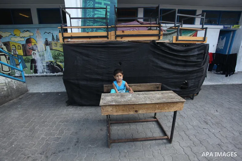 Displaced Palestinians shelter at a United Nations-run school, in Gaza city, on Sept. 13, 2014. Some 34 school buildings in Gaza are damaged beyond repair and 31 more are still being used as shelters, while Gaza prepare...