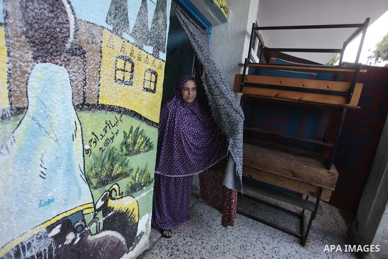 Displaced Palestinians shelter at a United Nations-run school, in Gaza city, on Sept. 13, 2014. Some 34 school buildings in Gaza are damaged beyond repair and 31 more are still being used as shelters, while Gaza prepare...