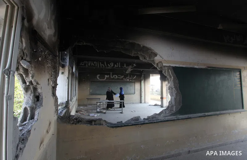 Palestinians prepare a school that damaged by fighting between Hamas Militants and Israel, before a new school year in Gaza strip, at Al-Shojaeya neighborhood in Gaza city on Sept. 13, 2014. Some 34 school buildings in G...