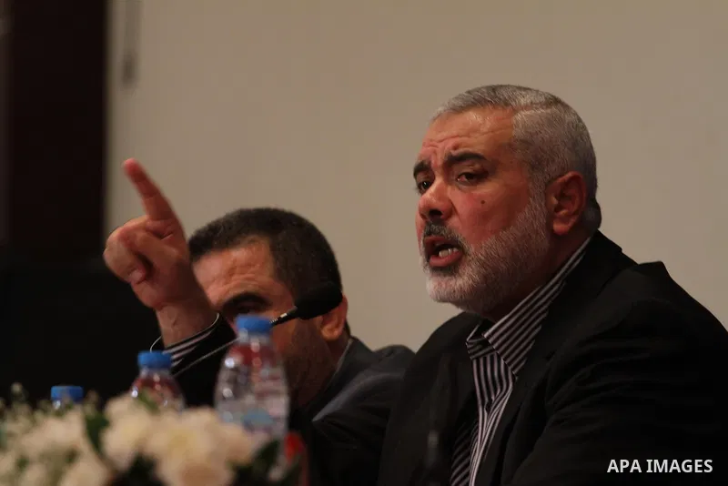 Senior leader of Hamas Ismail Haniyeh speaks during a meeting with members of media in Gaza city on Sept. 13, 2014. Photo by Mohammed Asad