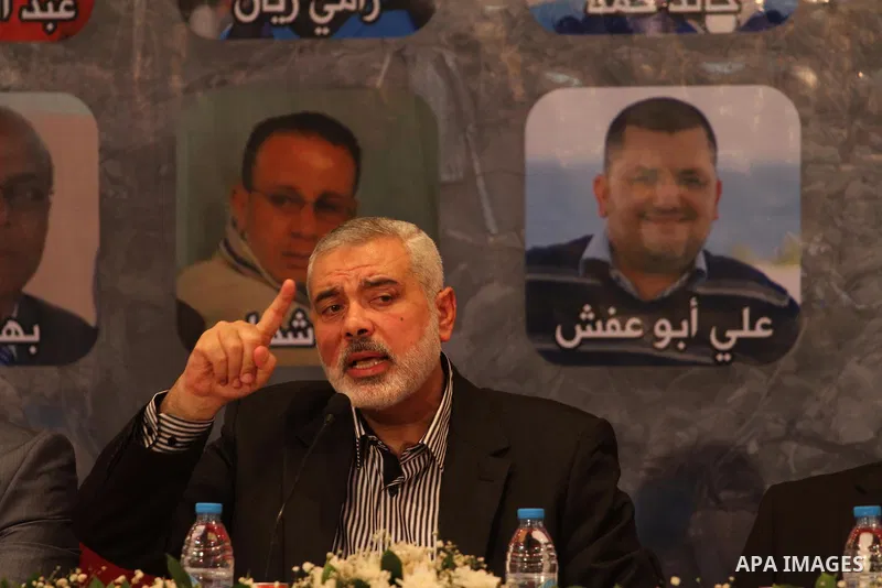 Senior leader of Hamas Ismail Haniyeh speaks during a meeting with members of media in Gaza city on Sept. 13, 2014. Photo by Mohammed Asad