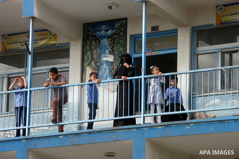 Palestinian students stand inside their a United Nations-run school, on the first day of the new school year in Rafah refugee camp in the southern Gaza Strip September 14, 2014. An open-ended ceasefire between Israel and...