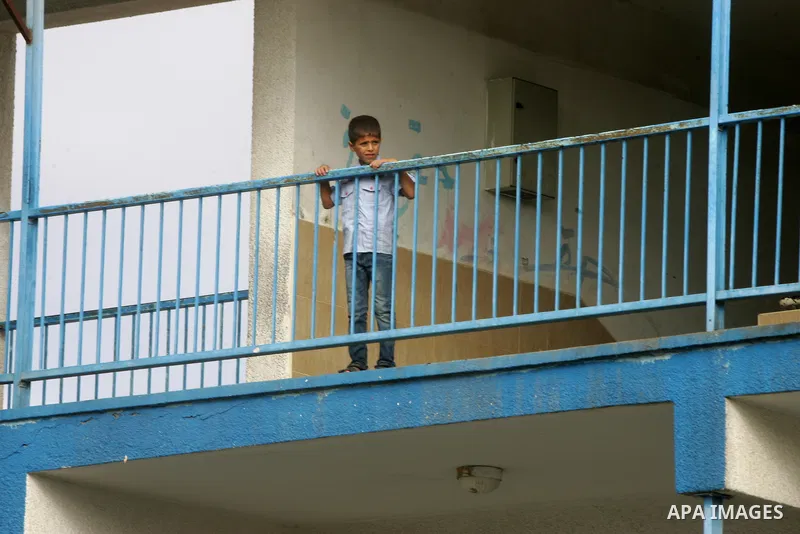 Palestinian students stand inside their a United Nations-run school, on the first day of the new school year in Rafah refugee camp in the southern Gaza Strip September 14, 2014. An open-ended ceasefire between Israel and...
