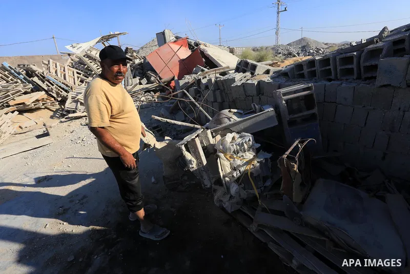 Palestinian workers smash large stones into small gravels to be used for building houses that witnesses said were destroyed by Israel during its offensive, in Gaza City September 14, 2014. An open-ended ceasefire between...