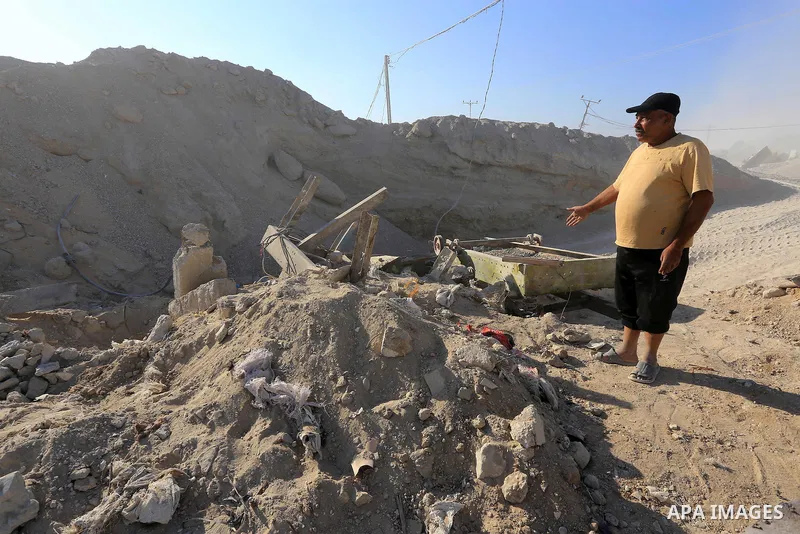 Palestinian workers smash large stones into small gravels to be used for building houses that witnesses said were destroyed by Israel during its offensive, in Gaza City September 14, 2014. An open-ended ceasefire between...