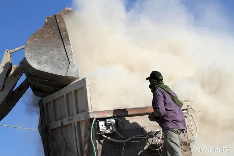 Palestinian workers smash large stones into small gravels to be used for building houses that witnesses said were destroyed by Israel during its offensive, in Gaza City September 14, 2014. An open-ended ceasefire between...