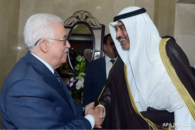 Palestinian President Mahmoud Abbas (L) meets Kuwait's Minister of Foreign Affairs Sheikh Sabah al Khalid al Sabah, in the West Bank city of Ramallah September 14, 2014. Photo by Thaer Ganaim