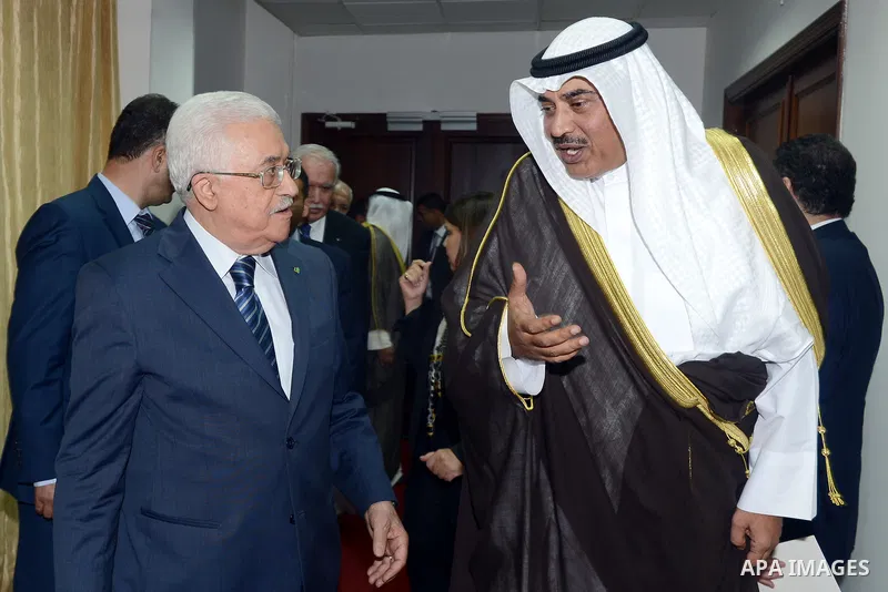 Palestinian President Mahmoud Abbas (L) meets Kuwait's Minister of Foreign Affairs Sheikh Sabah al Khalid al Sabah, in the West Bank city of Ramallah September 14, 2014. Photo by Thaer Ganaim