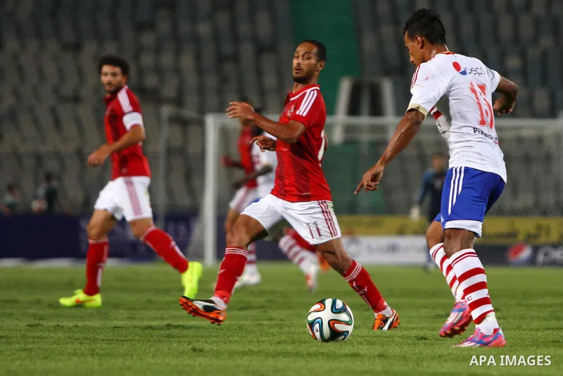 Al Ahly players compete against with Zamalek players during Egyptian Super Cup football match at the Cairo International Stadium, in Cairo, Egypt, Sunday Sept. 14, 2014. The Egyptian football association (EFA) said that...