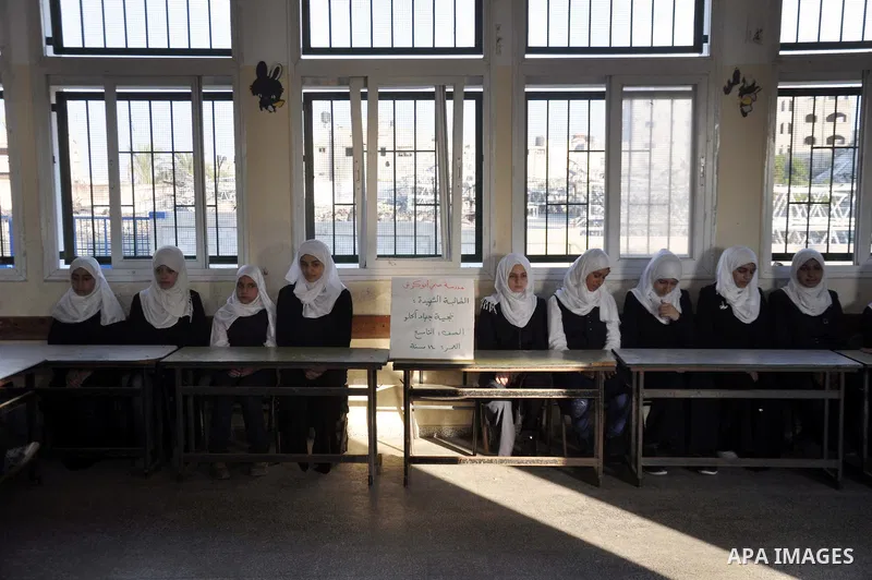 Palestinian students study inside their classroom on the second day of the school year in al-Sheiaeiya neighborhood in the east of Gaza City, on Sept 15, 2014. School year started in the Gaza Strip on Sunday after a thre...