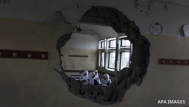 Palestinian students sit inside their classroom on the second day of the school year in al-Sheiaeiya neighborhood in the east of Gaza City, on Sept 15, 2014. School year started in the Gaza Strip on Sunday after a three-...
