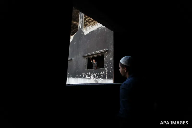 A Palestinian man inspects El-Awda factory that witnesses said was shelled by Israel during its offensive, in Gaza City September 16, 2014. An open-ended ceasefire between Israel and Hamas-led Gaza militants, mediated by...