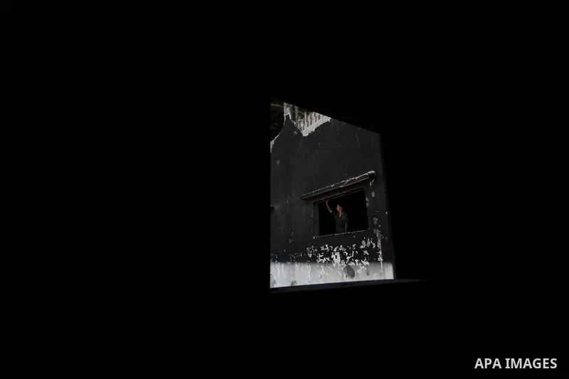 A Palestinian man inspects El-Awda factory that witnesses said was shelled by Israel during its offensive, in Gaza City September 16, 2014. An open-ended ceasefire between Israel and Hamas-led Gaza militants, mediated by...