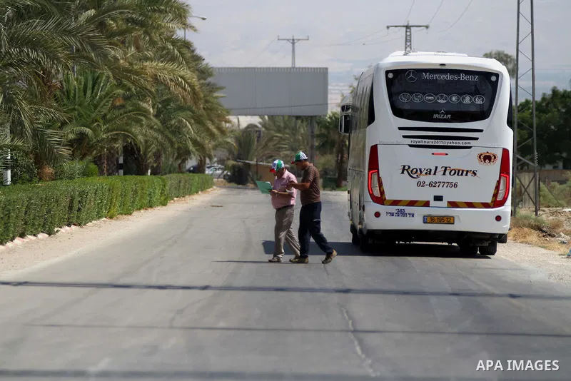 A bus carrying Palestinian Muslim pilgrims leaves en route to Al-Karama crossing between the West Bank and Jordan near Jericho, on Sept. 16, 2014, before leaving for the annual hajj pilgrimage to the holy city of Mecca....