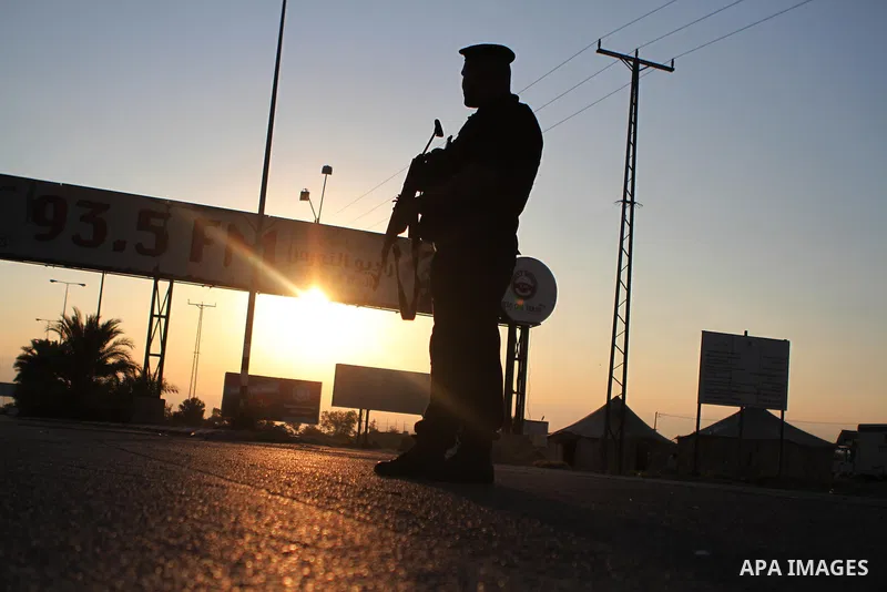 A Palestinian policeman stands guard at Al-Karama crossing between the West Bank and Jordan near Jericho, on Sept. 16, 2014, before leaving for the annual hajj pilgrimage to the holy city of Mecca. Hundreds of Palestinia...