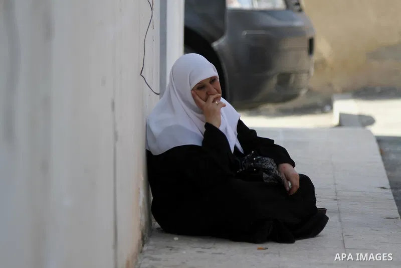 Palestinians Muslim pilgrims wait at Al-Karama crossing between the West Bank and Jordan near Jericho, on Sept. 16, 2014, before leaving for the annual hajj pilgrimage to the holy city of Mecca. Hundreds of Palestinian p...