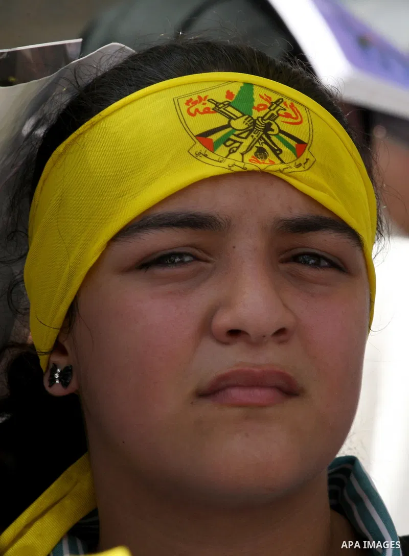 A Palestinian girl takes part in a protest marking the 48th anniversary of the Sabra and Shatila massacre in 1982, in the West Bank city of Nablus, September 16, 2014. The Sabra and Shatila massacre was the slaughter of...