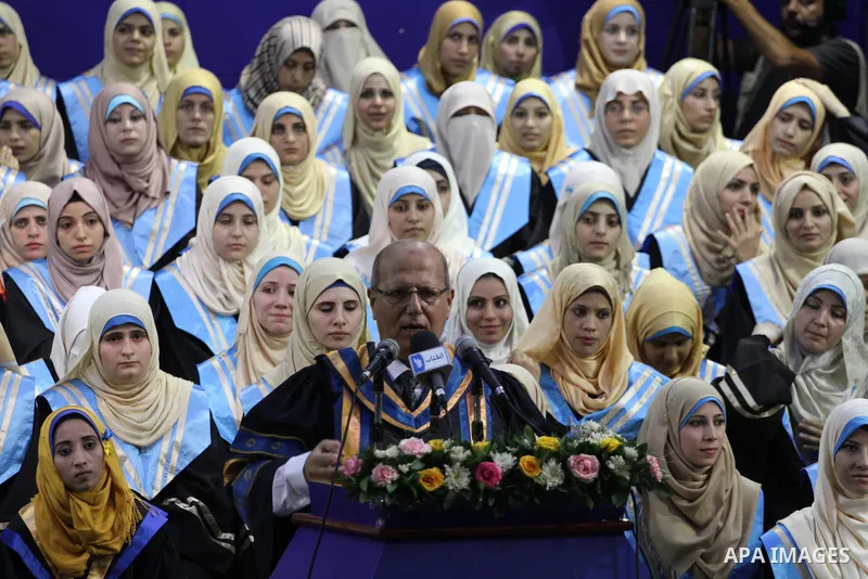 Palestinian students participate in their graduation ceremony at the Islamic University in Gaza city on September 16, 2014, supposed to be involved some of students were killed during air raids on the Gaza Strip. Photo b...
