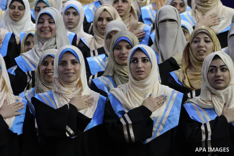 Palestinian students participate in their graduation ceremony at the Islamic University in Gaza city on September 16, 2014, supposed to be involved some of students were killed during air raids on the Gaza Strip. Photo b...