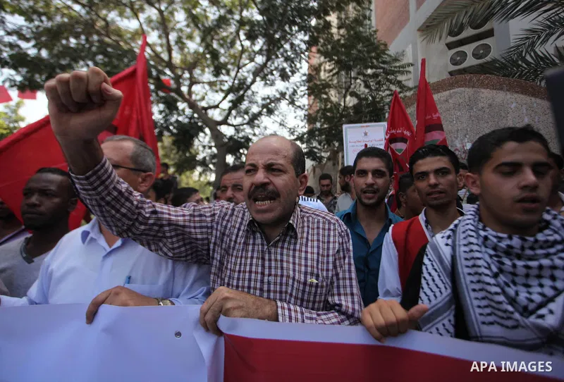 Palestinian University students take part in a protest to demand for exemption from tuition fees, in Gaza city, on Sept. 17, 2014. An open-ended ceasefire between Israel and Hamas-led Gaza militants, mediated by Egypt, t...