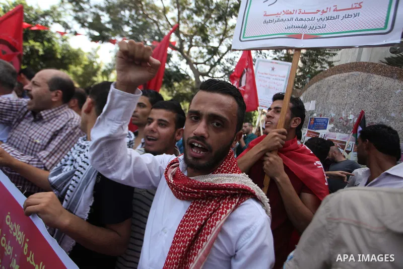 Palestinian University students take part in a protest to demand for exemption from tuition fees, in Gaza city, on Sept. 17, 2014. An open-ended ceasefire between Israel and Hamas-led Gaza militants, mediated by Egypt, t...