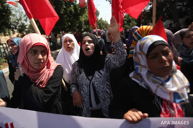 Palestinian University students take part in a protest to demand for exemption from tuition fees, in Gaza city, on Sept. 17, 2014. An open-ended ceasefire between Israel and Hamas-led Gaza militants, mediated by Egypt, t...