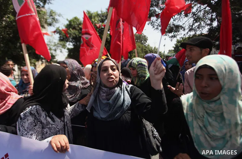 Palestinian University students take part in a protest to demand for exemption from tuition fees, in Gaza city, on Sept. 17, 2014. An open-ended ceasefire between Israel and Hamas-led Gaza militants, mediated by Egypt, t...