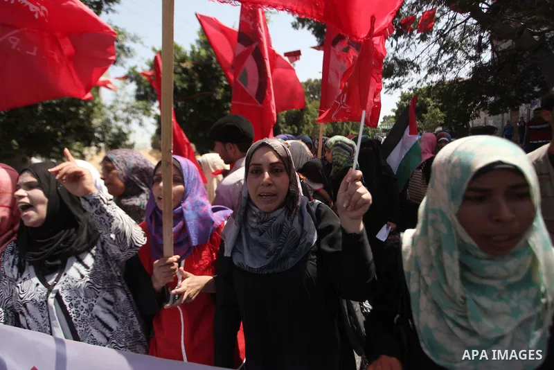 Palestinian University students take part in a protest to demand for exemption from tuition fees, in Gaza city, on Sept. 17, 2014. An open-ended ceasefire between Israel and Hamas-led Gaza militants, mediated by Egypt, t...
