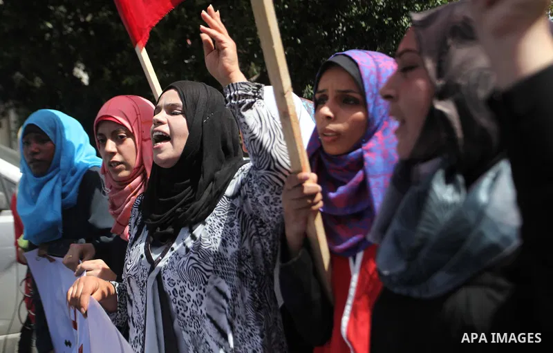 Palestinian University students take part in a protest to demand for exemption from tuition fees, in Gaza city, on Sept. 17, 2014. An open-ended ceasefire between Israel and Hamas-led Gaza militants, mediated by Egypt, t...