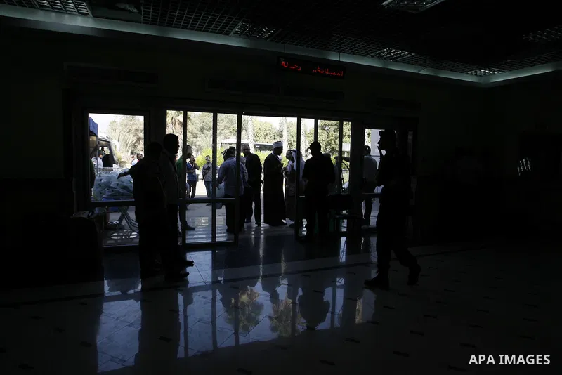 Palestinians Muslim pilgrims wait at the Rafah crossing between Egypt and the southern Gaza Strip, on Sept. 18, 2014, before leaving for the annual hajj pilgrimage to the holy city of Mecca. Hundreds of Palestinian pilgr...