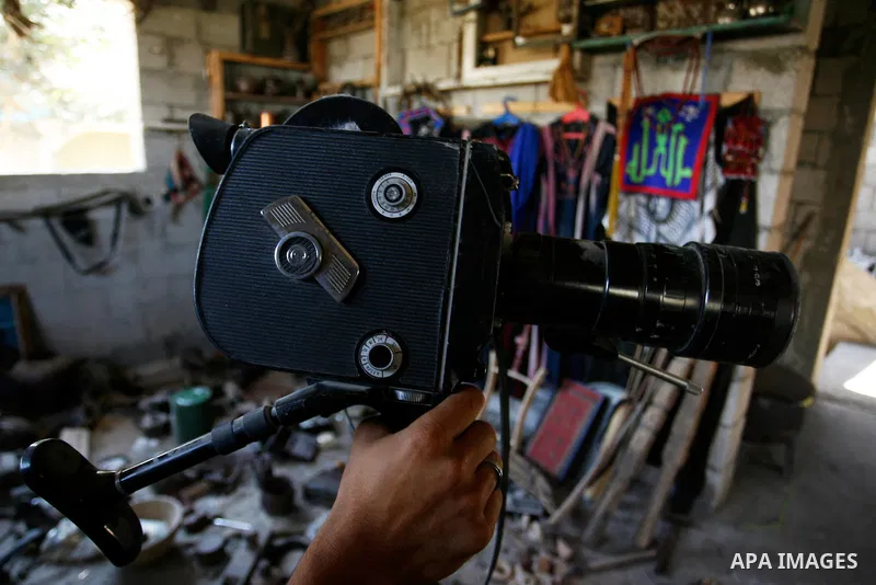 Jamal Abu Elian, 50, a Palestinian man shows and Old camera at his museum, in Khan Younis in the southern Gaza Strip, September 16, 2014. Israeli army destroyed the museum during the offensive on Gaza strip and stole som...