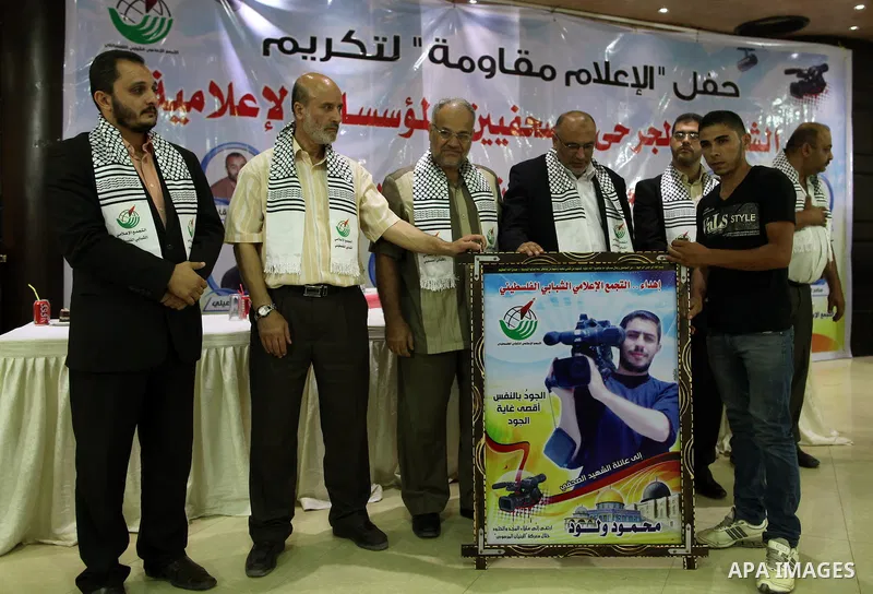 Palestinians attend a ceremony to honor the relatives of the media members who were killed in the Israeli offensive on Sep. 22, 2014. An open-ended ceasefire between Israel and Hamas-led Gaza militants, mediated by Egypt...